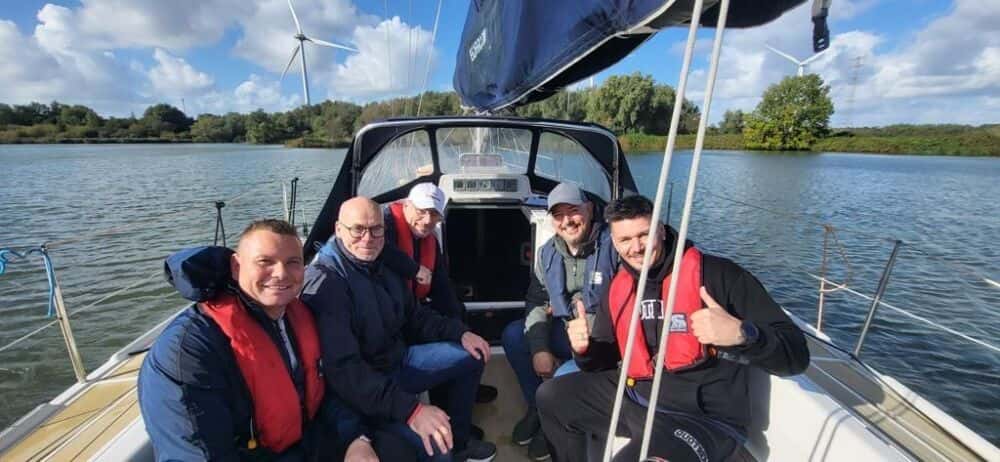 5 people on a boat