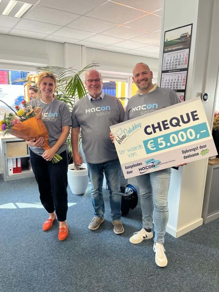 three people with a check
